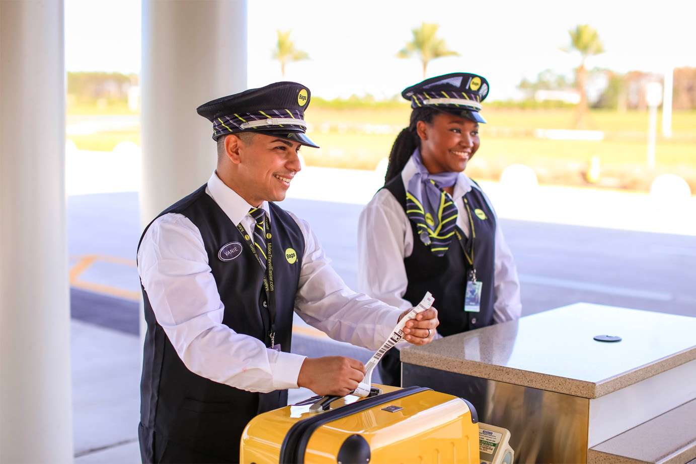 Bags employees helping customers at remote check-in